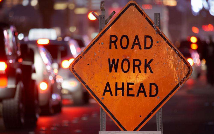 traffic with road work ahead sign