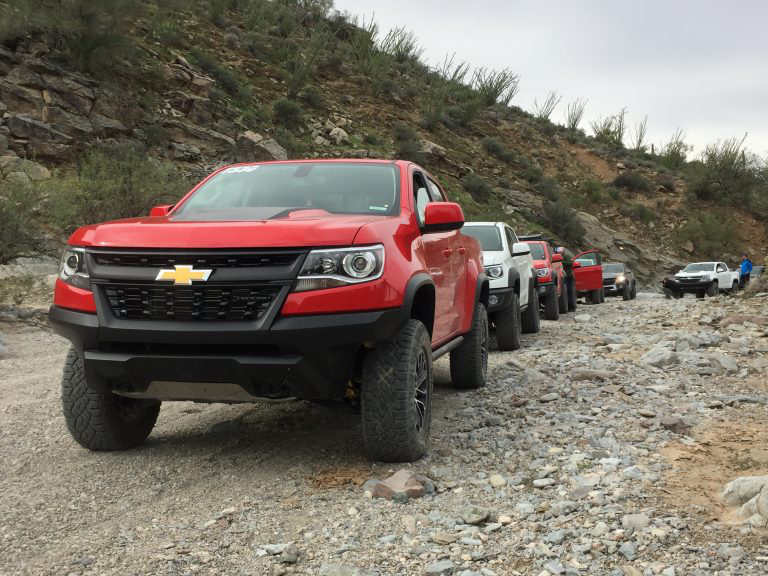 Row of Chevy Colorados Off-Roading