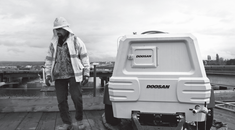 Construction worker with Doosan equipment