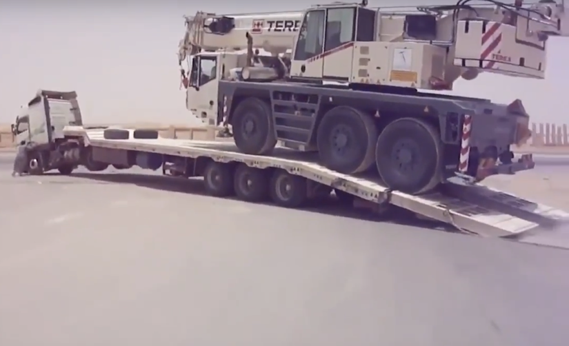 Terex crane being loaded onto a trailer