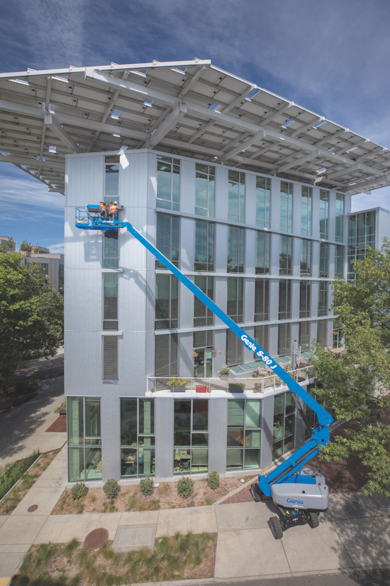 Genie S-80 J boom lift at commercial building site