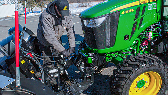 SnowEx Automatixx attachment on john deere tractor