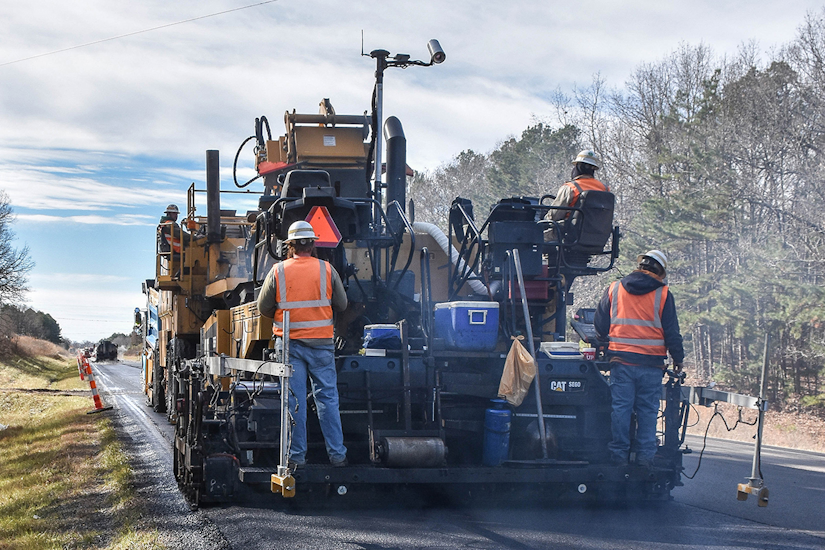 crews monitoring asphalt paving temperature with Cat Thermal Mapping 
