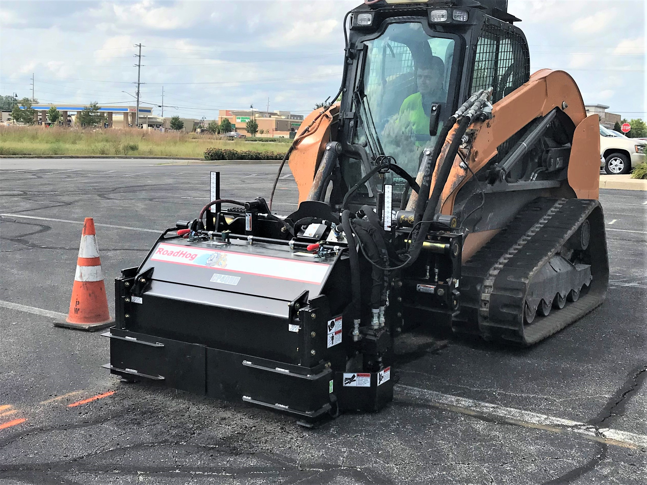 RoadHog's G5HD skid steer cold planer attached to a skid steer